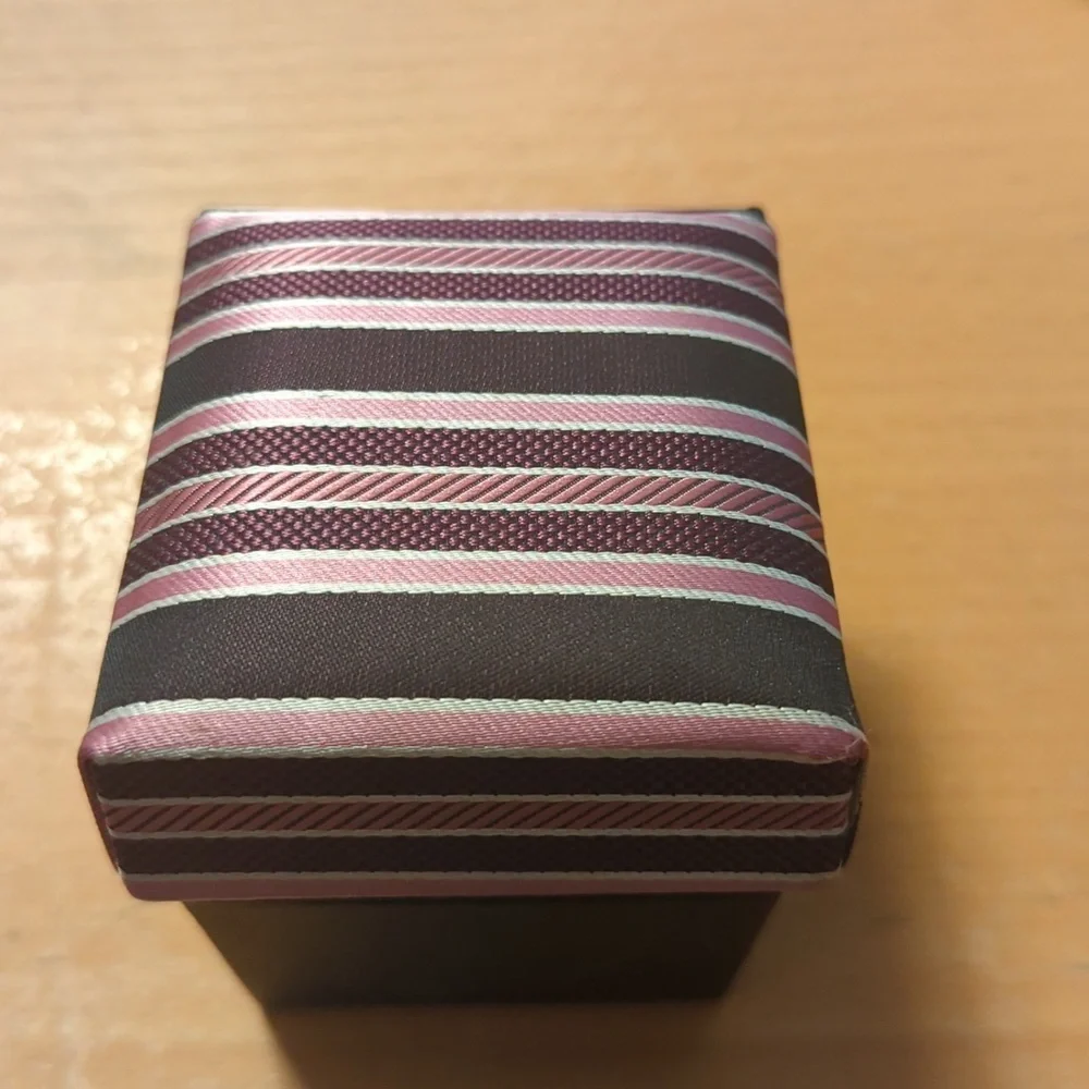 Cuff links with pocket square in a box